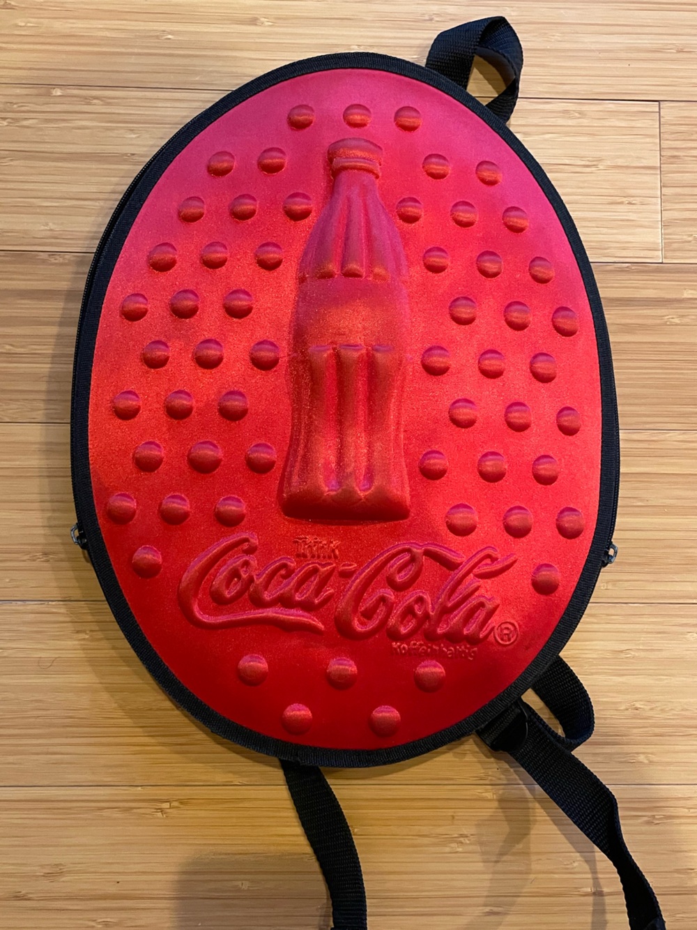 Official Coca-Cola Red Embossed Bottle Backpack with Black Trim from Germany